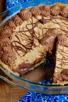 a pie with chocolate frosting on top is cut in half to show the inside