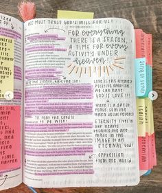 an open bible with writing on it and colorful sticky notes attached to the book's pages