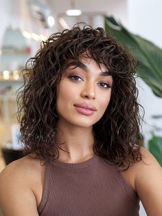 Shoulder-length wavy curly hair with face-framing fringe