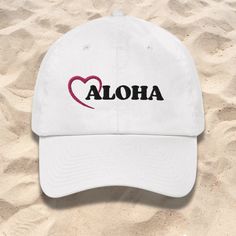 The Aloha with Heart Dad Hat Baseball Cap is a stylish, fun and fashionable way to express your love of Hawaii. Find more Aloha Hawaii Tropical Beach Hats here>> https://www.etsy.com/shop/TheHawaiianVagabond?section_id=40776448 Bring a little bit of paradise to your life with this stylish baseball cap. The Aloha with Heart Fitted Dad Hat is a perfect fit for anyone who loves Hawaii and added comfort while exploring our beautiful beaches. Let the Aloha spirit guide you on your way to paradise. A Hawaii Tropical, Beach Hats, Aloha Spirit, Spirit Guide, Aloha Hawaii, Hat Baseball, Ocean Lover, Tropical Island, Hawaiian Islands