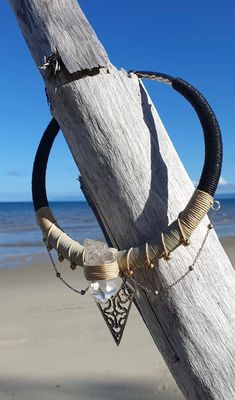 《 Shipibo Quartz Priestess Choker 》 Unique bold handcrafted choker.   Created on a flexible silver plated choker necklace by AlchemEyez. This piece sings of cleansing in the shamanic feminine with a white witch feel. Wrapped with black to cream/beige cotton cord and a strong faux cream cord finish.  Highlighting a large gorgeous and very clear hand picked Quartz crystal point.  Draped with a dainty silver chain and standout silver shipibo pendant.  This is a strong and large choker, a really stu One Of A Kind Adjustable Choker Necklace, One-of-a-kind Adjustable Choker Necklace, Unique Festival Pendant Choker, Unique Pendant Choker For Festivals, Handmade Spiritual Choker For Festivals, Handmade Metal Crystal Choker Necklace, Bohemian Crystal Choker For Festivals, Nickel Free Choker Necklace For Festivals, Festival Wire Wrapped Choker Jewelry