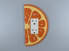 Let's Get Fruity -We think adding a little fruity outlet cover would be berry sweet! Perfect for a kitchen or bedroom. Choose one of our strawberry or citrus covers to add the perfect finishing touch to your room! -Ships with your choice of White or Black Screws! Dimensions - 3-7/8 Wide x 7" Tall -This outlet cover is larger than standard sizes. Please ensure to measure the clearance around your outlet before ordering to avoid purchasing something that might not fit in your home.  Material -This is a 3D printed product. Our products are made from an environmentally safe plastic called PLA. Because our products are 3D printed there may be slight imperfections in the product. We strive for perfection, however, view each product as unique. Each product is carefully inspected before the shippi Plate Wall, Outlet Cover, Household Decor, Kitchen Accents, Outlet Covers, Wall Plate, Live Light, Home Decor Kitchen, Decor Kitchen