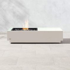 a fire pit sitting on top of a tiled floor