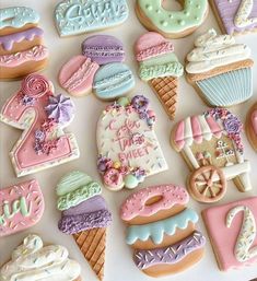 some decorated cookies are laying on a table