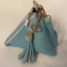 Super Cute Nwt Baby Blue Wristlet Handbag With Gold Zipper And A Tassel Detail. 7.5"X7.5"X7.5". Blue Clutch With Mobile Phone Bag For Daily Use, Blue Shoulder Bag With Zipper Closure As Gift, Blue Clutch Mobile Phone Bag As Gift, Blue Mobile Phone Bag Clutch For Daily Use, Blue Mobile Phone Bag Clutch As Gift, Blue Shoulder Bag With Zipper Pouch As Gift, Blue Pouch With Zipper Closure As Gift, Blue Crossbody Clutch As Gift, Trendy Blue Coin Purse For Travel