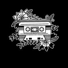 a black and white bag with an image of a cassette player surrounded by flowers on it