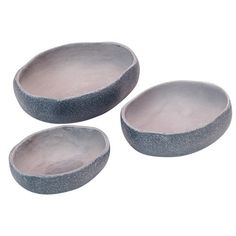 three gray bowls sitting next to each other