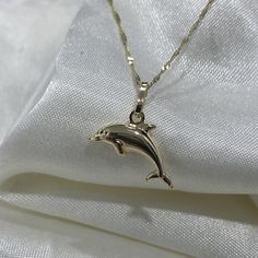 Ioka - Real 14K Gold Dolphin Necklace, Dainty Dolphin Charm Pendant with 0.9mm Singapore Chain, Sea Ocean Animal Jewelry ✅PENDANT SPECIFICATIONS: * Height: 0.51 in. (13 MM) * Width: 0.59 in. (15 MM) * Average Weight: 0.73 gr. ✅CHAIN SPECIFICATIONS: * Clasp: Spring-Ring   * Width: 0.9 MM ➤ Length: 16 inches   Avg Weight: 0.64 ➤ Length: 18 inches   Avg Weight: 0.71 ➤ Length: 20 inches   Avg Weight: 0.76 ➤ Length: 22 inches   Avg Weight: 0.83 ✅SHIPPING CONTENTS: *14K Gold Pendant & Chain *Complimen Penguin Necklace, Dolphin Charm, Ethereal Jewelry, Dolphin Pendant, Dolphin Jewelry, Dolphin Necklace, Gold Chain With Pendant, Jewelry Accessories Ideas, Average Weight