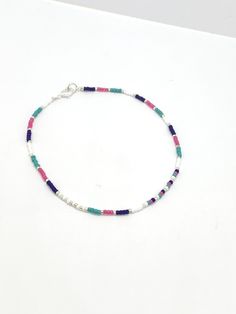 Turquoise, royal blue, pink and white seed bead anklet Dimensions Seed beads are 2mm glass Plated findings An extender is available Postage: UK: Items are sent 2nd class mail, but can be upgraded to 1st class mail for a small fee at checkout. International orders are sent by Standard Royal Mail - untracked. An upgrade is available at checkout. Thank you for visiting and please come back again. If you have any queries, please don't hesitate to contact me. Beaded anklet women, colourful bead ankle Dainty Colorful Beads Anklets As A Gift, Dainty Anklets With Colorful Beads As Gift, Dainty Colorful Beaded Anklets As Gift, Gift Multicolor Round Bead Anklets, Gift Multicolor Round Beads Anklets, Multicolor Beaded Chain Anklets As Gift, Multicolor Round Beads Anklets As Gift, Multicolor Round Beads Anklets For Gift, Gift Anklets With Tiny Beads