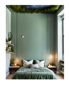 a bedroom with green walls and white pillows on the bed, hanging from strings over the headboard