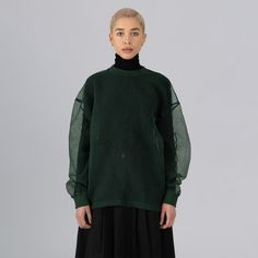 Step out in eco-conscious style with our green top. Oversized for a casual fit, it features a sheer round neck design for a chic, effortless look. Crafted from a lightweight, non-stretch fabric, it offers elasticated cuffs and neck, and comfortably dropped shoulders. Note: Fit runs large. Effortless Look, Organza Top, Round Neck Design, Jungle Green, Oversized Blouse, Swimwear Shorts, Green Top, Green Tops, Casual Fit