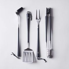 the utensils are lined up on top of each other in different shapes and sizes