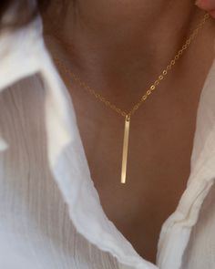 Simple gold bar necklace, featuring 14K gold filled pendant, chain and findings/ Sterling silver pendant, chain and findings. Bar measures 2.5 X 21mm Turn this necklace also a Back necklace Check out our clip on Back Necklace Chain : https://www.etsy.com/listing/250871895/mini-bead-back-necklace-dainty-beck-drop?ref=shop_home_active_1 ■ SHIPPING UPGRADES You can find shipping upgrades options in the drop bar menu when you check out.  * Within the U.S Regular First-class : 2-6 business days Prior Minimalist Yellow Gold Bar Necklace With Rectangular Pendant, Minimalist Jewelry With Delicate Chain And Rectangular Pendant, Gold Minimalist Rectangular Bar Necklace, Minimalist Gold Rectangular Bar Necklace, Gold Rectangular Minimalist Bar Necklace, Gold Minimalist Jewelry With Rectangular Pendant, Gold Bar Necklace With Rectangular Pendant For Everyday, Modern Gold Bar Necklace With Rectangular Pendant, Minimalist Necklace With Rectangular Pendant And Delicate Chain