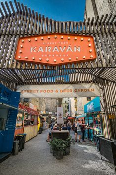 the entrance to an outdoor food and beer garden