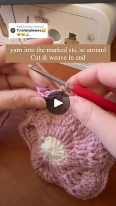 someone crocheting the yarn on top of an object with scissors and knitting needles