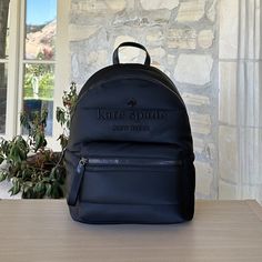 Guaranteed Authentic Brand New With Tags Attached Kate Spade New York Ella Ksnyl Puffy Backpack Bag Kc550 Black (001) Women Nwt Measurements 11.8" W X 15.72" H X 6.4" D Handle Drop: 2.5" Features Embroidered Logo Closure Type: Zip Around Closure Dust Bag Included: No Interior: Back 13" Laptop Slip Pocket, Back Slip Pockets, Front Credit Card Slots Exterior: Front Zip Pocket Materials Recycled Nylon Trim: Smooth Pvc Trim Lining: Two Way Script Logo Lining Imported Style Number Kc550 Smoke/Pet Fre Trendy Kate Spade Standard Backpack, Trendy Kate Spade Backpack, Kate Spade Backpack With Zipper Closure, Kate Spade Casual Backpack For On-the-go, Kate Spade Casual School Backpack, Casual Kate Spade Backpack For On-the-go, Casual Kate Spade School Backpack, Kate Spade Black Backpack For Errands, Kate Spade Casual Standard Backpack