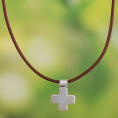 Appealingly simple, this pendant necklace is designed by Rosa Tomatis in Peru. The brushed sterling silver cross centers a brown leather-covered cotton cord. Adjustable Brown Cross Pendant Necklace, Metal Clay Jewelry, Sterling Silver Necklace Pendants, Metal Clay, Sterling Silver Cross, Artisan Craft, Cotton Cord, Silver Cross, Silver Pendant Necklace