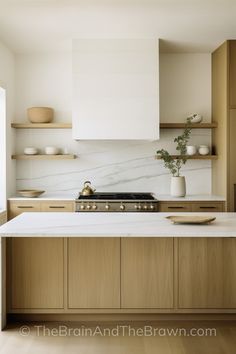 a kitchen with white counter tops and wooden cabinets