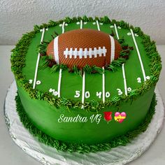 a green cake with a football on it