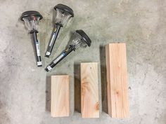 four different types of woodworking tools sitting next to each other on the cement floor