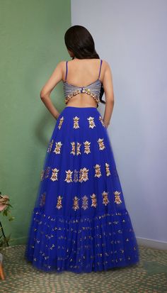 Introducing Artworq, a stunning iris blue lehenga designed to make you feel like royalty on your special day. Exquisitly crafted from a soft tulle base and embellished with shimmering glass crystals and intricate glass-cut beaded embroidery. The matching blouse features a stylish and modern cut, the piece comes with a matching dupatta, adorned with glass crystals and glass-cut beaded embroidery. From Papa Don’t Preach’s Capsule collection. DELIVERY TIMEPlease allow 8-12 weeks for your outfit to Blue Sharara With Traditional Drape For Reception, Blue Embellished Sharara For Reception, Blue Organza Sets With Dori Work, Blue Anarkali Sharara For Reception, Blue Embellished Sharara For Party Wear, Traditional Hand Embellished Blue Choli, Traditional Hand Embellished Blue Set, Festive Blue Embellished Sharara, Festive Embellished Blue Sharara