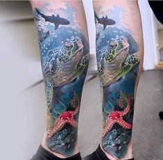 a man's leg with a turtle and starfish tattoo on it