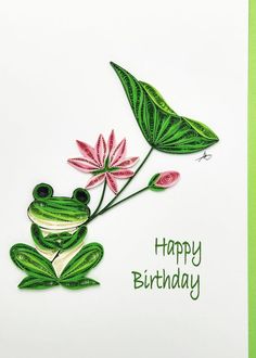 a green frog sitting on top of a leaf next to a pink flower with the words happy birthday