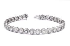 Experience the allure of "Timeless Enchanting Elegance" with our exquisite Cluster Bracelet, featuring an astonishing 4.26 carats of Natural Diamonds set in luxurious 18K White Gold.  DETAILS:  Metal: 18kt White Gold    Weight: 11.45 grams  Gemstone: Natural Diamonds  Shape: Round Brilliant  Total Carat Weight: 4.26CT Number of Diamonds: 228 Average Clarity: VVS Colour: F-G Length: 18cm Closure: Box Clasp  CERTIFICATE: Authenticity Certificate Included  The overall effect of the flower pattern a Luxury Round Platinum Diamond Bracelet, Elegant Wedding Bracelets With Halo Setting, Luxury Silver Bracelet With Halo Setting, Fine Jewelry Bracelet In Diamond White, Fine Jewelry Diamond White Round Bracelets, Exquisite Round Bracelets With Single Cut Diamonds, Exquisite Bracelets With Single Cut Diamonds, Formal Bracelet With Halo Setting, White Gold Bracelet With Halo Setting For Wedding