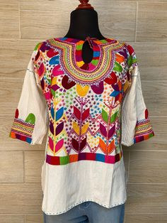 "Mexican blouse, hand embroidered mexican blouse, blouse with beautiful cornfield embroidered blouse, blanket blouse, ethnic blouse. Each blouse is a unique piece so colors may vary. Inch measure: Size S/M from armpit to armpit: 22\" LONG: 26\" Size L/XL from armpit to armpit: 24\" LONG: 27\" We ship anywhere in the word, from Tepic, Nayarit, mx. Made by artisans from Oaxaca, Mx We recommend washing by hand with cold water, tender in the shade, to better preserve the original color." Traditional Multicolor Embroidered Peasant Top For Fall, Traditional Fall Peasant Top With Multicolor Embroidery, Festival Blouse With Woven Motifs, Folk Style Blouse With Woven Motifs For Festivals, Bohemian Shirt With Floral Embroidery For Fall, Multicolor Embroidered Top For Fall Festival, Fall Festival Blouse With Multicolor Embroidery, Fall Festival Embroidered Top With Multicolor Embroidery, Fall Festival Multicolor Embroidered Top