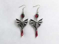 🖤 Elevate your Halloween look with our Gothic Vampire Witch Earrings! 🌹 These stunning black rose earrings combine gothic charm with a touch of vampiric elegance, perfect for any witchy wardrobe or darkly glamorous outfit. Whether you're heading to a holiday party or just want to showcase your unique style, these earrings add a dramatic flair! 👻✨ 🔮 Features: Gothic Elegance: Intricate black rose design  Perfect for Vampires and Witches: Ideal for Halloween and gothic fashion enthusiasts Holiday Ready: Stand out at 2024 holiday parties with these unique accessories Personalized Touch: Creative and unique design to express your individual style Gothic Nickel-free Earrings For Alternative Fashion, Black Halloween Cosplay Earrings, Black Earrings For Halloween Cosplay, Gothic Metal Earrings For Party, Black Gothic Earrings For Cosplay, Black Rose Jewelry, Black Rose Design, Witchy Wardrobe, Vampire Earrings