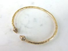 "A WOMEN'S OR MENS VINTAGE ESTATE 14K YELLOW GOLD CUFF BRACELET. THE INSIDE CIRCUMFERENCE OF THE BRACELET MEASURES ABOUT 7 1/4\" AND ABOUT 1/8\" WIDE. BRACELET WEIGHS 21.3g. BRACELET IS NOT MARKED BUT IT HAS BEEN TESTED AND IS GUARANTEED TO BE AS DESCRIBED. THIS WOULD MAKE A LOVELY GIFT AND IS A GREAT VALUE FOR THE MONEY. IF ANY OTHER QUESTIONS, PLEASE ASK. BE SURE TO CHECK OUT SOME OF MY OTHER GREAT ITEMS UP FOR SALE. THANK YOU. IF THERE ARE ANY ISSUES PLEASE CONTACT US, WE'RE ALWAYS HAPPY TO T Antique Gold Cuff Bracelet For Anniversary, Victorian Gold Cuff Bracelet For Anniversary, Vintage Yellow Gold Cuff Bracelet For Ceremonial Occasions, Antique Gold Cuff Bracelet With 17 Jewels, Vintage Yellow Gold Cuff Bracelet For Anniversary, Silver Turtle Ring, Yellow Gold Cuff Bracelet, Gold Cuff Bracelet, Sterling Silver Heart Pendant