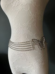 Very High Quality Chain Belt with Austrian Rhinestones. Strong Silver Chain.  Butterfly Detail and Butterfly Tail Drop to the Chain.  This Belt is another Limited Edition of only 100 pieces designed by the FAN Fashion Team.  Adjustable to UK Size 8-16 Elegant Silver Crystal Chain Belt, Silver Chain Strap Belt For Evening, Elegant Silver Crystal Waist Chain, Elegant Crystal Waist Chain For Party, Rhinestone Chain Belt For Party, Metal Rhinestone Necklace With Chain For Wedding, Metal Rhinestone Chain Necklace For Wedding, Silver Crystal Chain Belt For Party, Elegant Rhinestone Waist Chain For Party