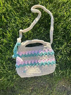 This is the PERFECT bag for spring time! These beautiful tulips will bloom all those around you. This bag fits a 10th generation Ipad and so much more! It also comes with a cute embroidered tulip and a small tulip plush bag charm! Spring Crochet Bag With Top Carry Handle, Green Pouch Satchel For Spring, Cute Cream Bags For Spring, Cute Spring Shoulder Bag With Adjustable Strap, Spring Satchel With Removable Pouch, Handheld Green Satchel For Spring, Spring Gift Rectangular Satchel, Spring Green Tote Satchel, Green Tote Satchel For Spring