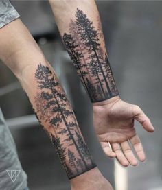 two people holding hands with trees on them