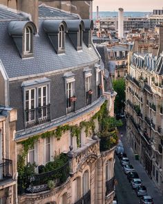 an aerial view of a building with many windows and balconies on the roof