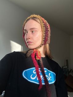 a woman with long hair wearing a knitted hat