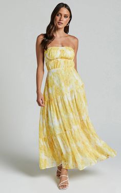 Make a bold statement in our Cardelyn Midi Dress. This strapless fit and flare tiered dress is perfect for your next party or day out. The vibrant yellow floral print adds a touch of sunshine to any occasion, while the flattering silhouette accentuates your curves. Made with high-quality polyester fabric, this midi dress not only looks amazing but also feels incredibly comfortable to wear. Whether you're dancing the night away or enjoying a sunny brunch, our Cardelyn Midi Dress will have you fee Floral Yellow Dress, Semi Formal Outfit, Pretty Little Dress, Tiered Dresses, Yellow Floral Dress, Yellow Midi Dress, Strapless Maxi Dress, Formal Outfit, Little Dresses