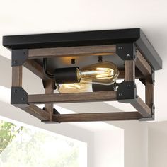 the light fixture is made from wood and metal