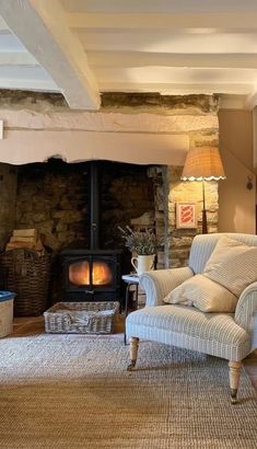 a living room filled with furniture and a fire place