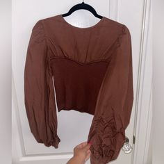 Beautiful Blouse. Color Brown, Size L. Never Worn. Brown Puff Sleeve Tops For Fall, Brown Fitted Long Sleeve Top, Fitted Long Sleeve Brown Top, Fitted Brown Long Sleeve Tops, Trendy Brown Puff Sleeve Top, Brown V-neck Top For Brunch, Chic Brown Tops For Brunch, Casual Puff Sleeve Tops For Date Night, Fitted Long Sleeve Blouse For Day Out