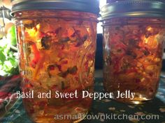 two jars filled with food sitting on top of a table