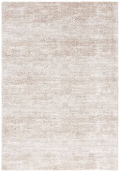 an area rug with white and beige colors on the bottom, in front of a white background