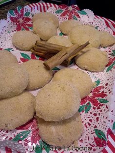 several cookies on a plate with cinnamon sticks