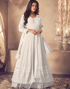 White Lehenga style Suit Semi-Stitched Suits Salwar Kameez in Embroidery, Sequins & Lace Work:Arabic Attire #indiansuitsonlineindia #designersalwarkameezonline #whatissalwar #salwarkameezpatterns #designasuit #kameezkurta #indiansuitneckdesigns #latestdesignerssuits #floralindiansuit #buychuridarsonline #turquoisesuitforladies #printedsuitforladies #salvarpatterns #salwarkameezwithdupatta #floralindiansuits #salwarkameeznecklinedesigns Anarkali Lehenga Gowns, Plain Lehenga, Kurti Style, White Lehenga, Anarkali Lehenga, Georgette Lehenga, Kameez Designs, Lehenga Suit, Lehenga Style