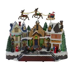 a christmas village with santa and his reindeer sleigh ride over the top of it