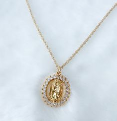 Our lady of Guadalupe necklace MATERIAL AND SIZE 18k gold plated medal 18k gold filled cable chain  Cubic zirconia  Size pendant: 2cmx1cm Length chain: 45cm If you have questions about the product, feel free to reach me out. Don't forget to check out my other items in the store: Https://www.etsy.com/shop/nyahwithlove Miraculous Medal Pendant Jewelry For Wedding, Miraculous Medal Wedding Pendant Jewelry, Wedding Miraculous Medal Pendant Jewelry, Spiritual Miraculous Medal Pendant Jewelry, Spiritual Miraculous Medal Oval Pendant Jewelry, Silver Our Lady Of Guadalupe Necklace, Spiritual Oval Pendant Jewelry With Miraculous Medal, Gold Virgin Mary Medallion Jewelry, Adjustable Spiritual Necklace With Miraculous Medal