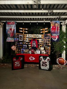 the display is decorated with sports memorabilia and photos for fans to sign on their jerseys