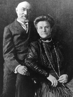 an old black and white photo of two people