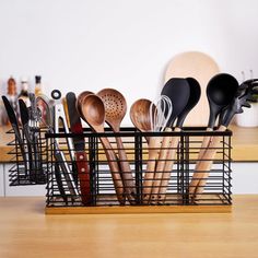 a basket filled with lots of kitchen utensils