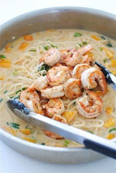 shrimp and noodle soup in a white bowl